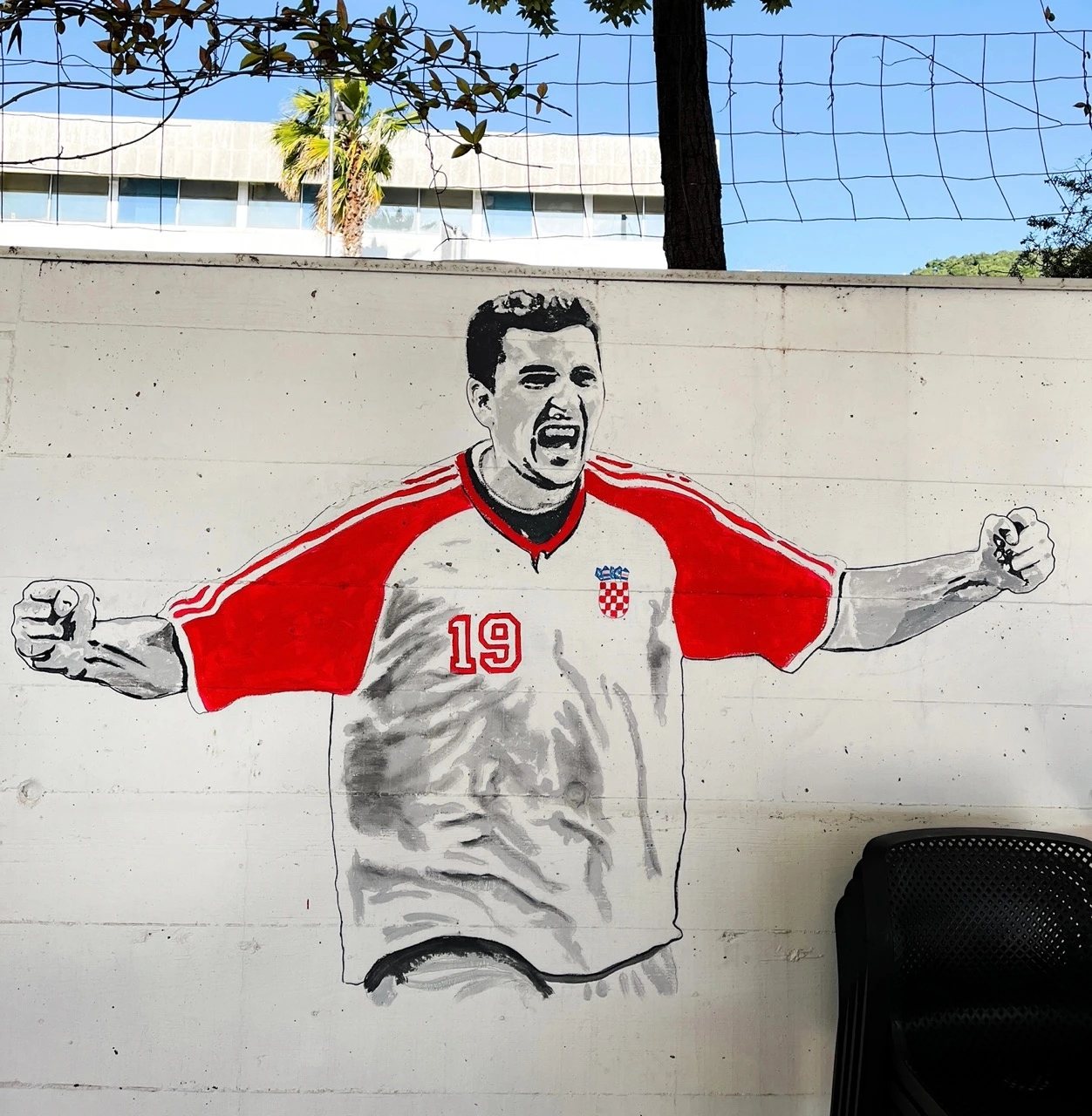 Painting of a Croatian soccer player on a wall.