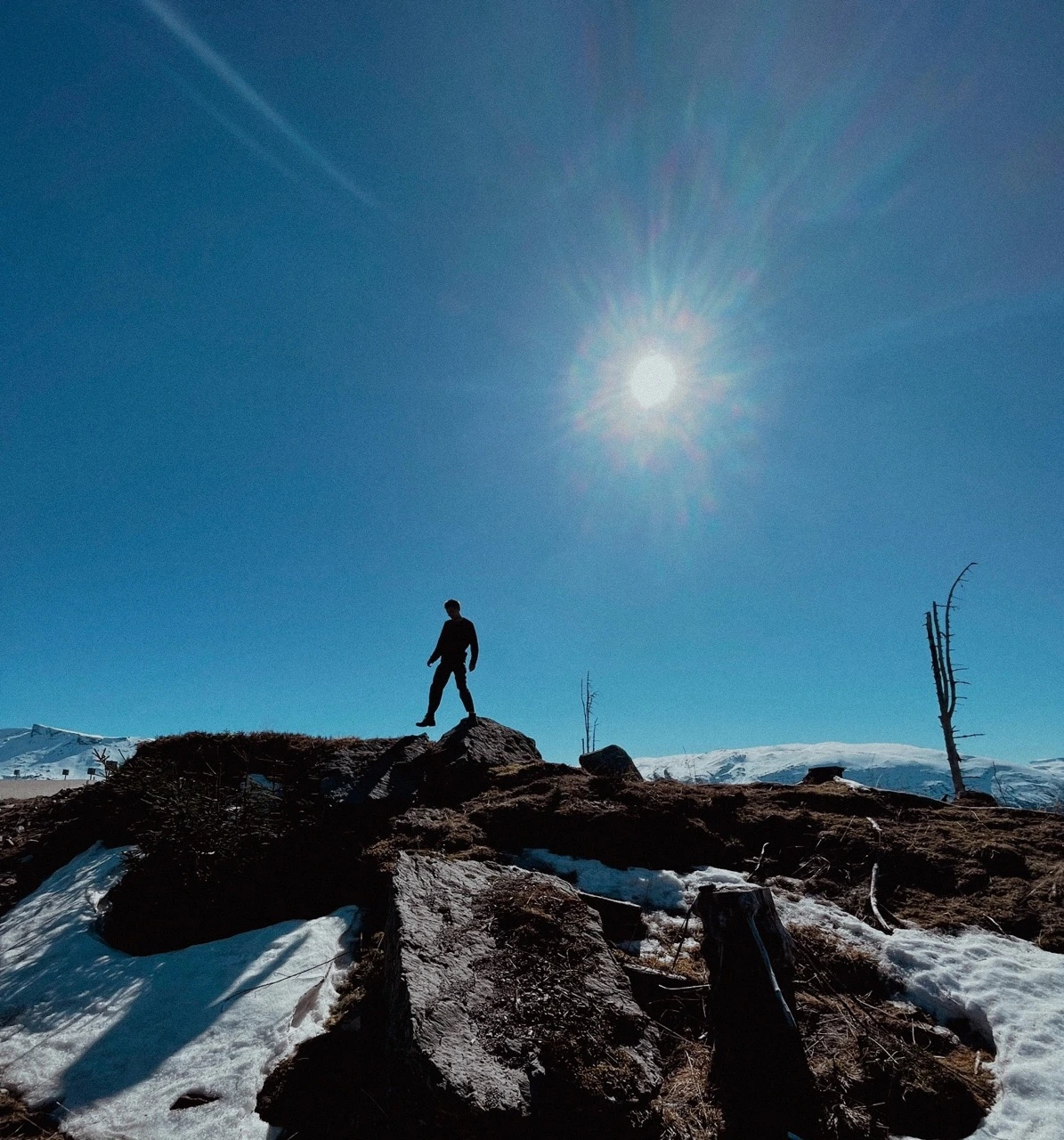 Sebastian climbing on rocks in Norway.